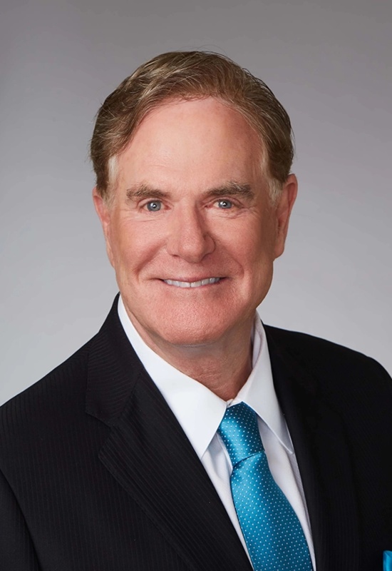 Joe Moglia, in a dark suit with a teal tie, Chairman at Capital Wealth Advisors in Naples, Florida